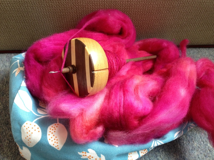 My lovely IST Crafts spindle with some pink fluff